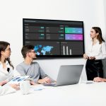 A business team is reviewing Performance Dashboards
